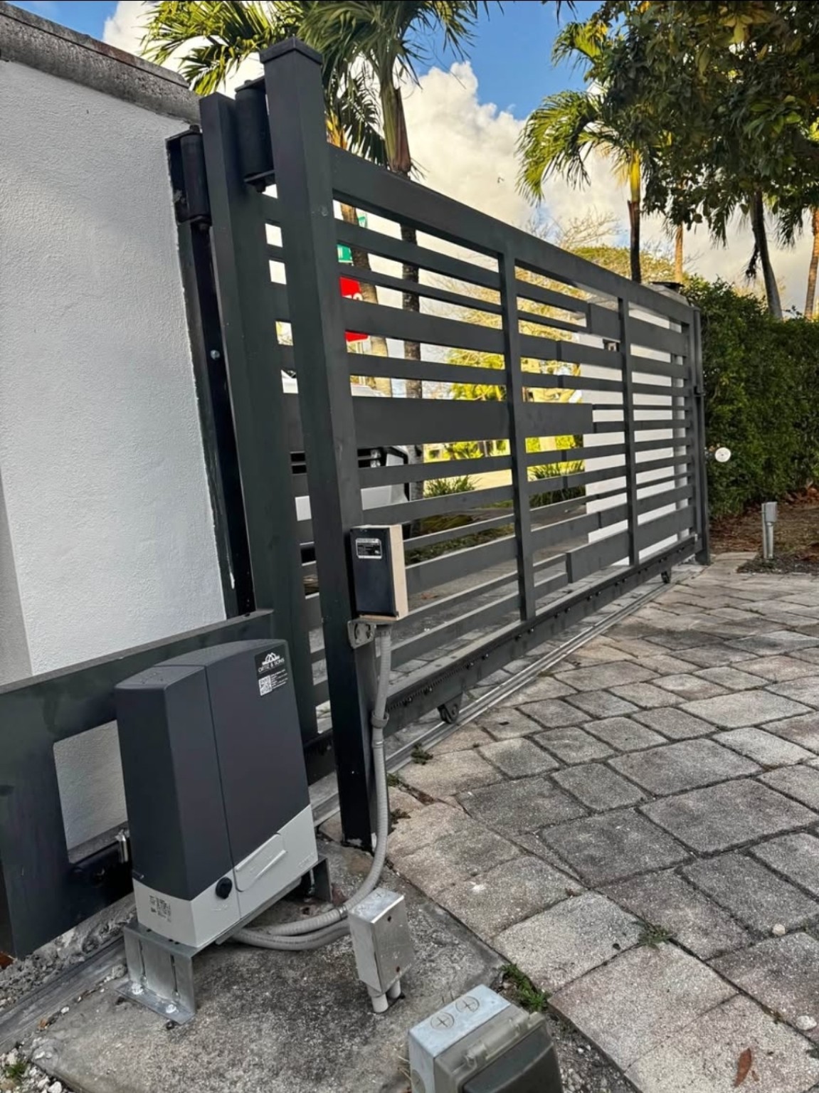 Automatic sliding gate operator and access control installation
